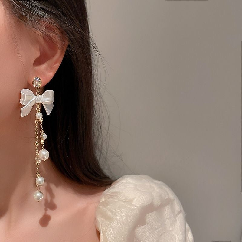 Boucles d'oreilles pendantes en forme de nœud papillon avec strass