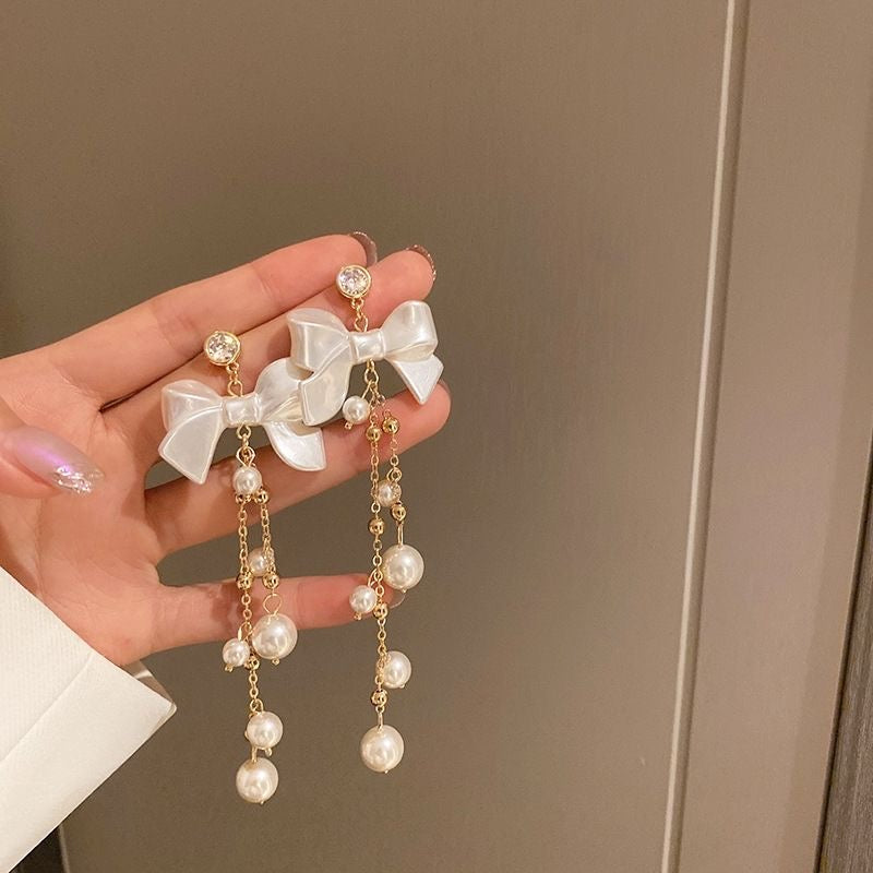 Boucles d'oreilles pendantes en forme de nœud papillon avec strass