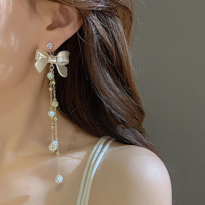 Boucles d'oreilles pendantes en forme de nœud papillon avec strass