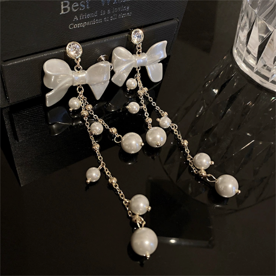Boucles d'oreilles pendantes en forme de nœud papillon avec strass