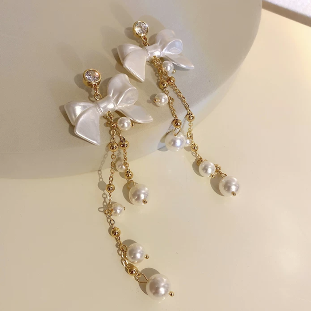 Boucles d'oreilles pendantes en forme de nœud papillon avec strass