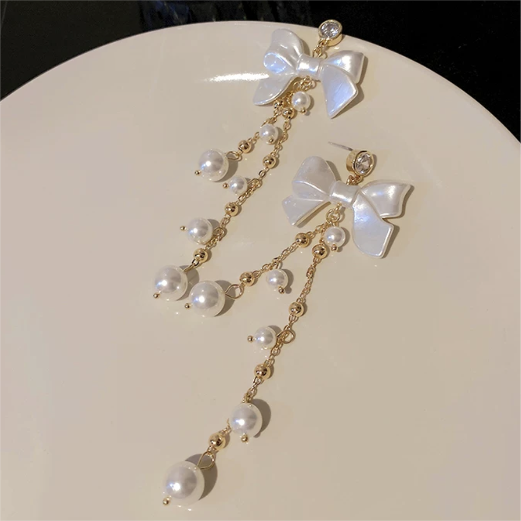 Boucles d'oreilles pendantes en forme de nœud papillon avec strass