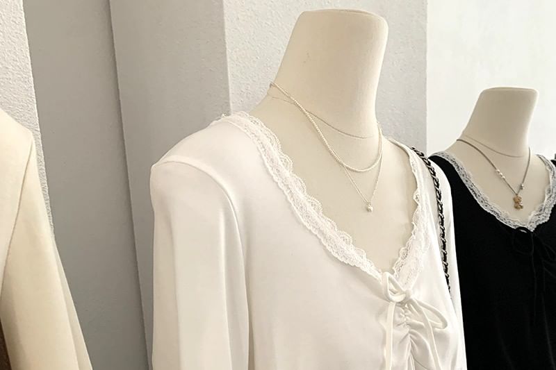 Long-Sleeve Tie-Front Top with Lace Accents and V-Neckline