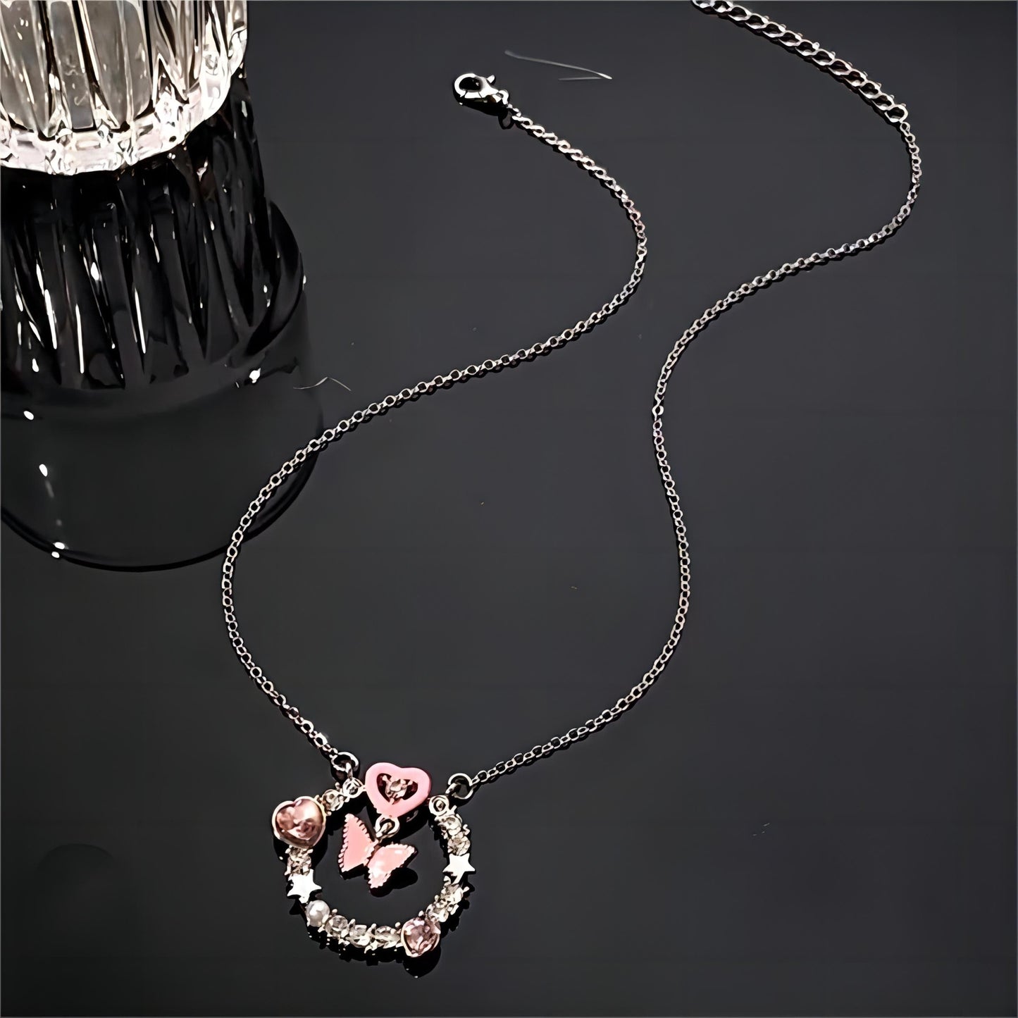 Collier avec anneau en forme de cœur et papillon rose