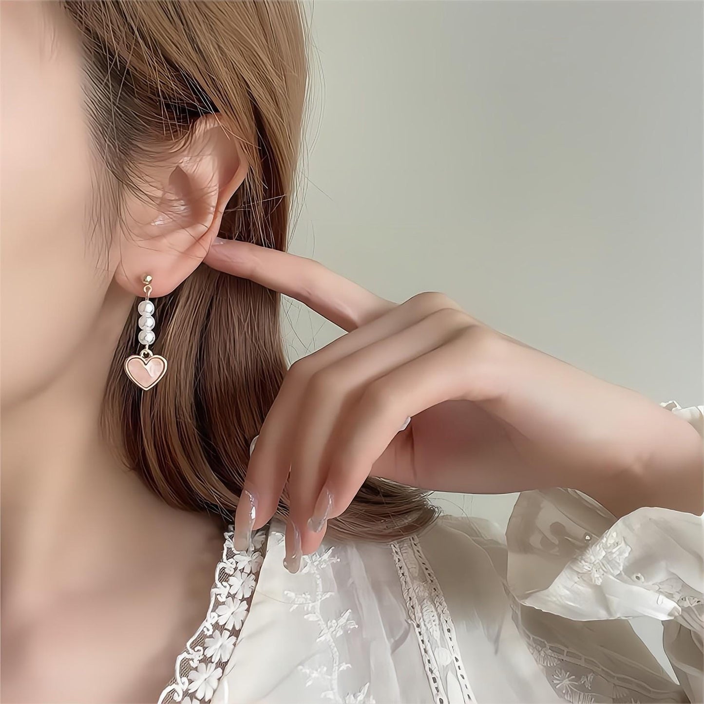 Boucles d'oreilles pendantes en forme de cœur en perles douces et chics