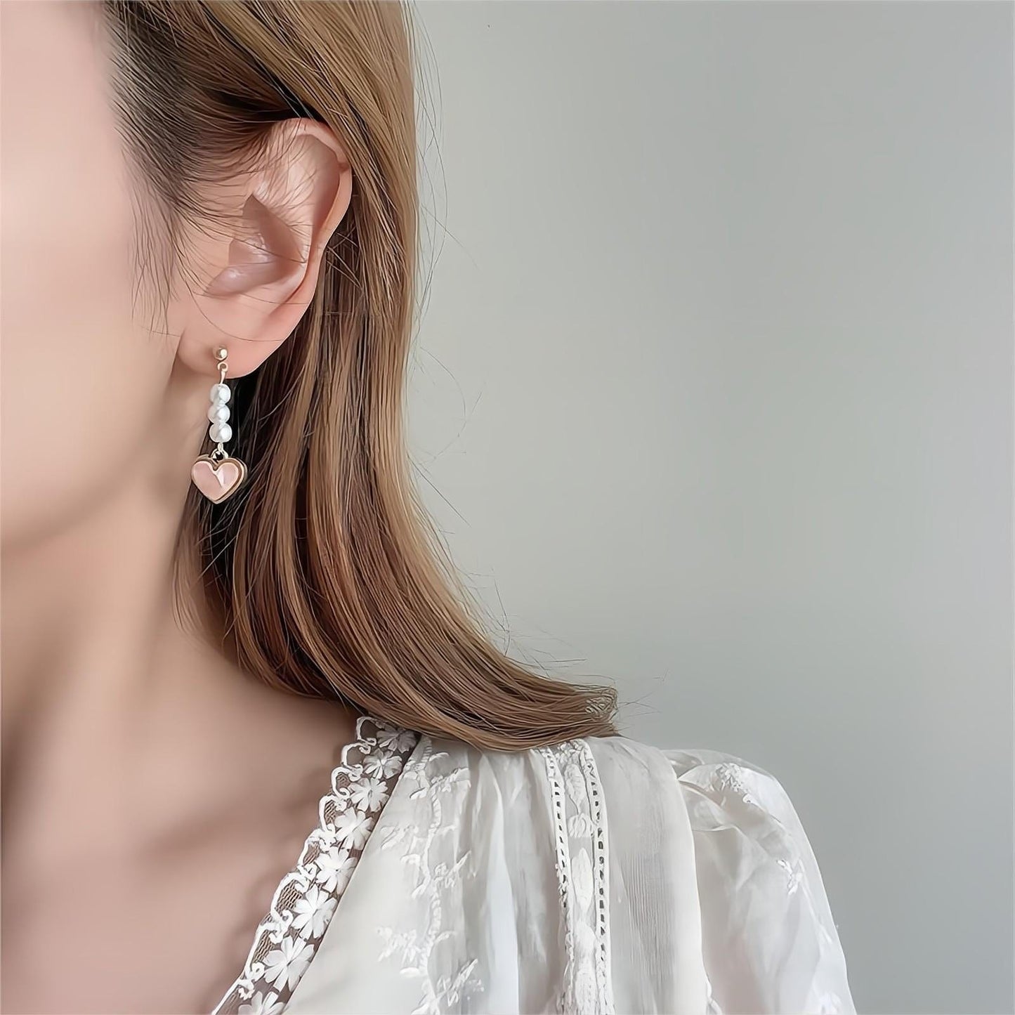 Boucles d'oreilles pendantes en forme de cœur en perles douces et chics