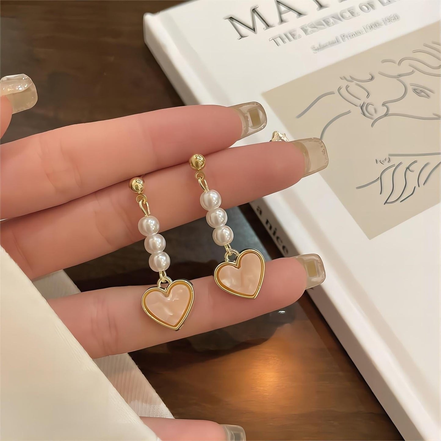 Boucles d'oreilles pendantes en forme de cœur en perles douces et chics