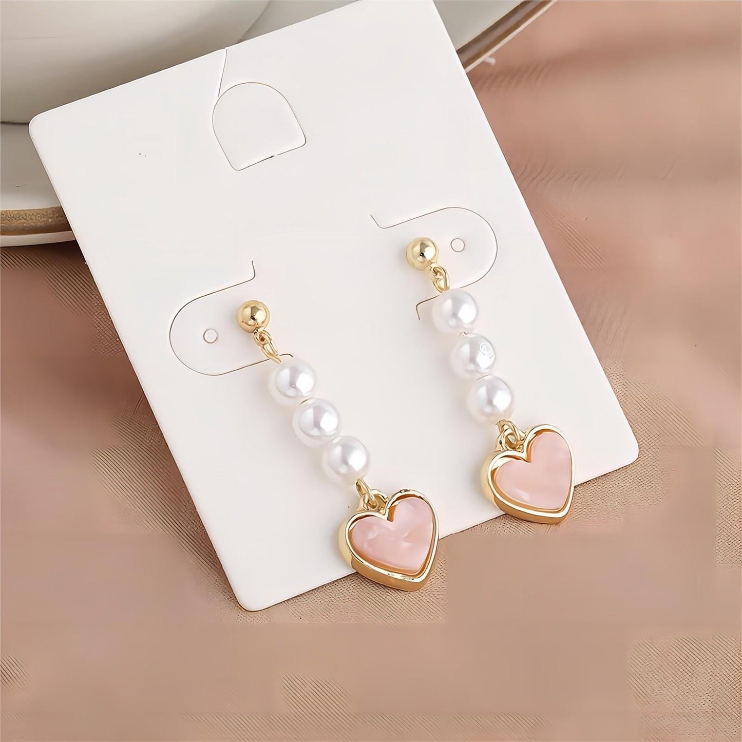 Boucles d'oreilles pendantes en forme de cœur en perles douces et chics