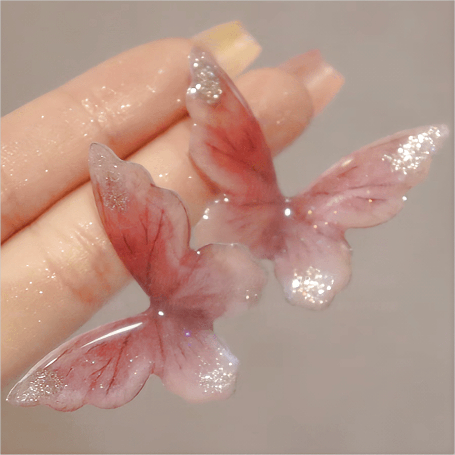 Boucles d'oreilles pendantes en forme de papillon rose
