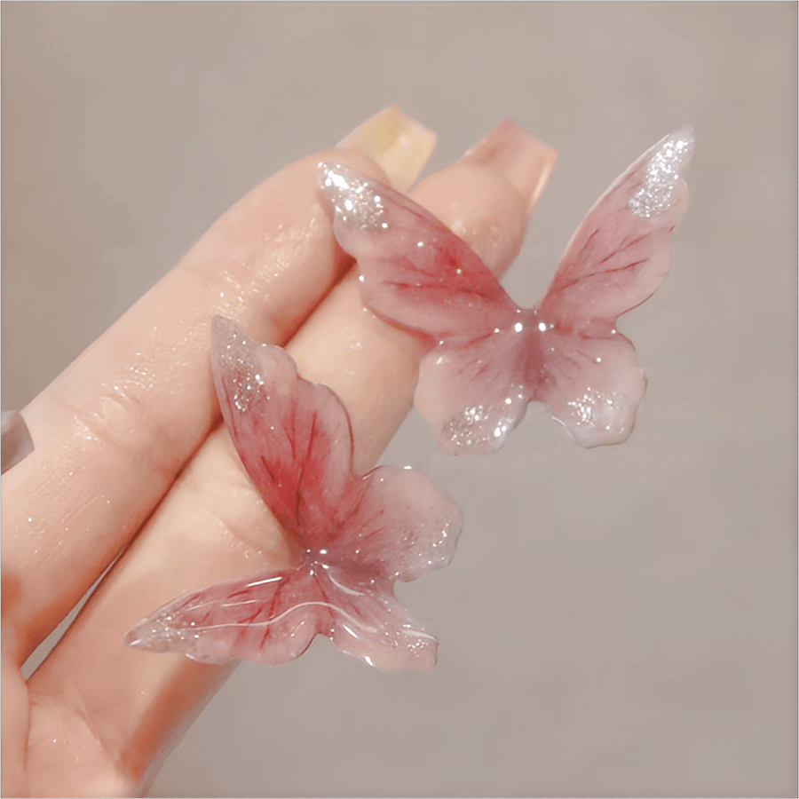 Boucles d'oreilles pendantes en forme de papillon rose