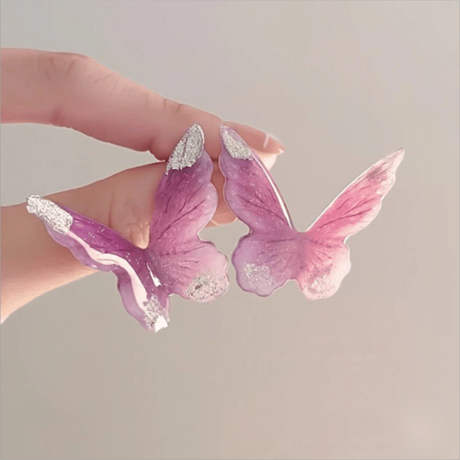 Boucles d'oreilles pendantes en forme de papillon rose