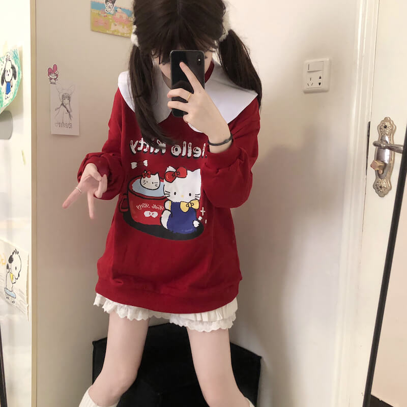 Sweat-shirt à col blanc avec chat rouge