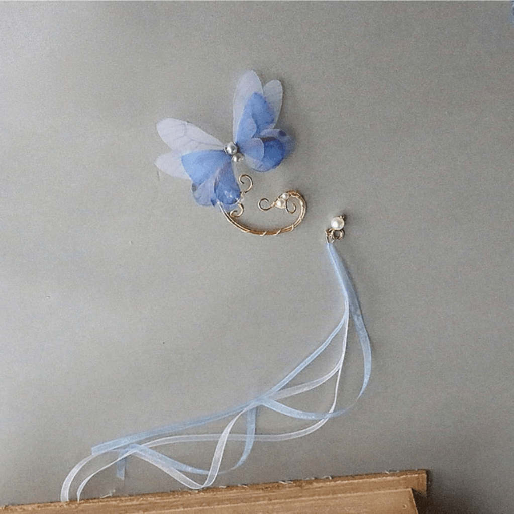 Eleganter mehrlagiger Ohrring mit Schmetterlingsperlen