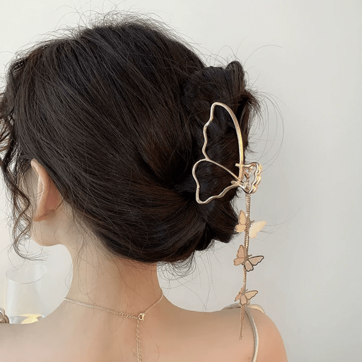 Pince à chignon à pompon en chaîne papillon