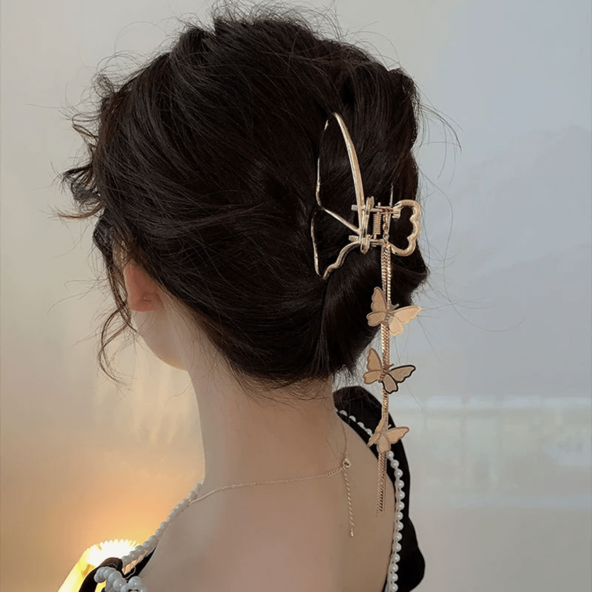 Pince à chignon à pompon en chaîne papillon