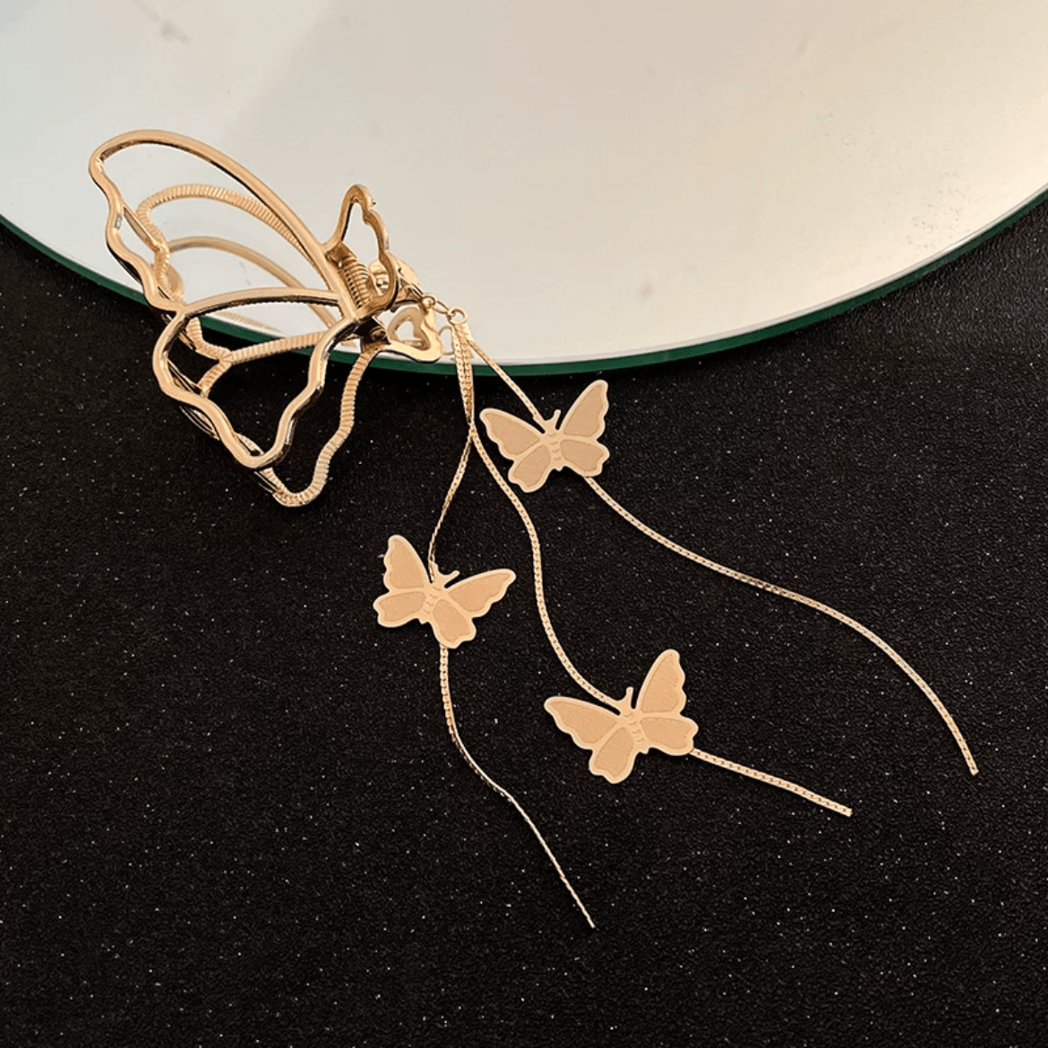 Pince à chignon à pompon en chaîne papillon