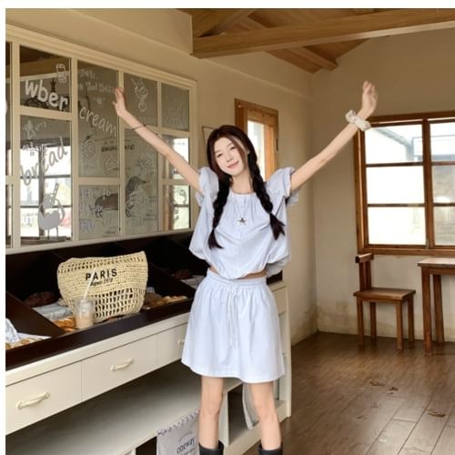 Shirred Puff-Sleeve Top Paired with High-Rise Mini Skirt