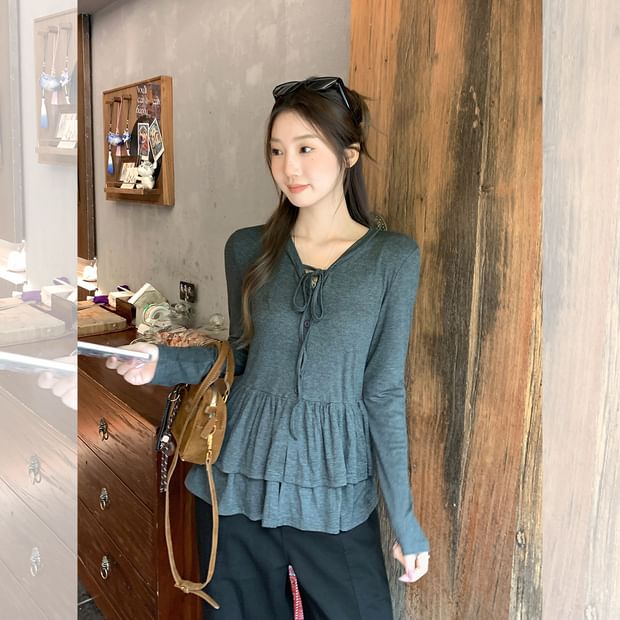 Melange Peplum Buttoned Tee with Tie Neck and Extended Sleeves