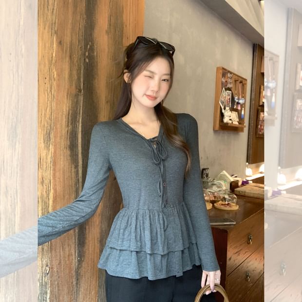 Melange Peplum Buttoned Tee with Tie Neck and Extended Sleeves