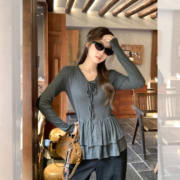 Melange Peplum Buttoned Tee with Tie Neck and Extended Sleeves