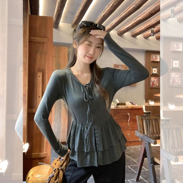 Melange Peplum Buttoned Tee with Tie Neck and Extended Sleeves