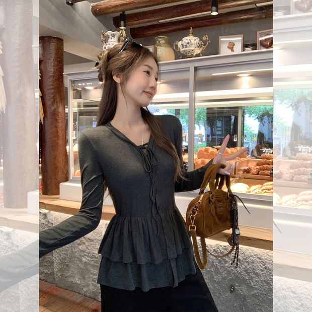 Melange Peplum Buttoned Tee with Tie Neck and Extended Sleeves