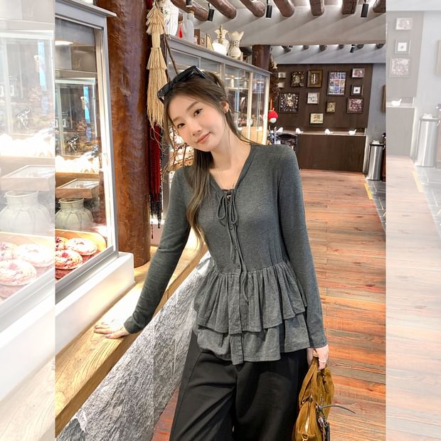 Melange Peplum Buttoned Tee with Tie Neck and Extended Sleeves