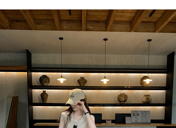 Slim-Fit Knit Top with Cap Sleeves and Notch Lapel in Solid Color