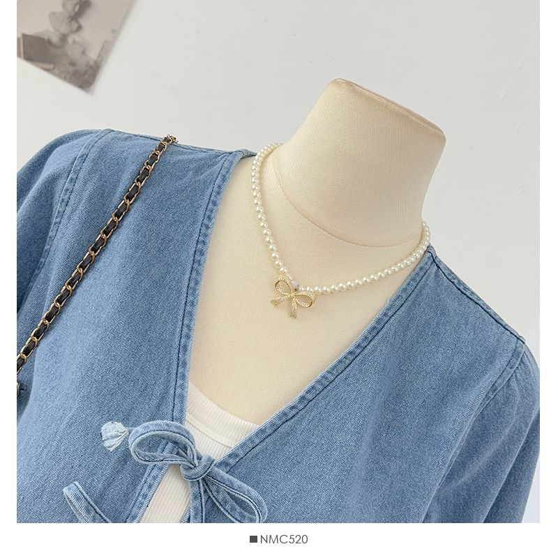 Ruffle Hem Denim Blouse with V-Neck Tie Front