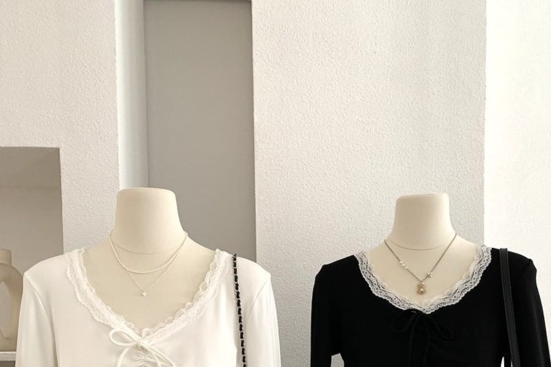 Long-Sleeve Tie-Front Top with Lace Accents and V-Neckline