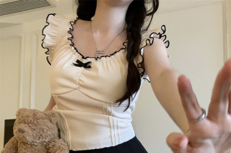 Ruffle-Trim Sleeveless Top with Pleated Mini Skirt