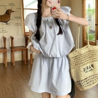 Shirred Puff-Sleeve Top Paired with High-Rise Mini Skirt