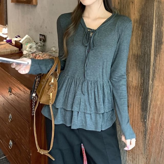 Melange Peplum Buttoned Tee with Tie Neck and Extended Sleeves