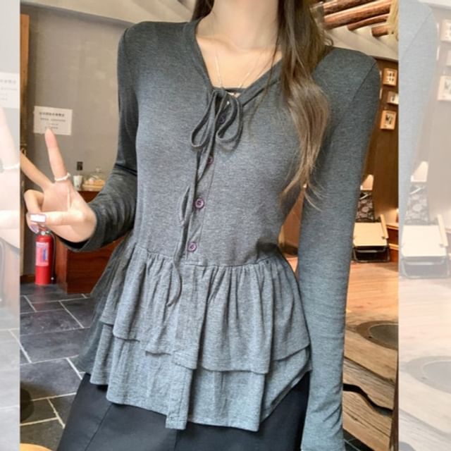 Melange Peplum Buttoned Tee with Tie Neck and Extended Sleeves