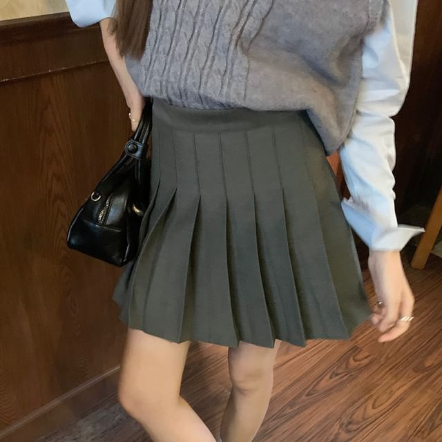 Crew Neck Long-Sleeve Button-Up Shirt with Mini Pleated Skirt & Cable Knit Vest