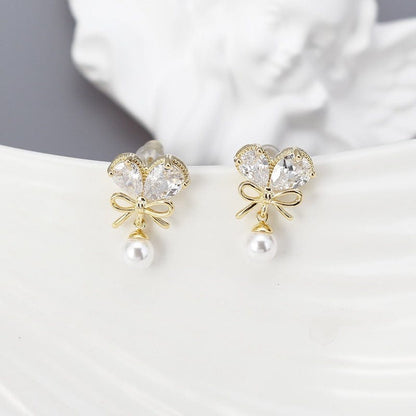 Boucles d'oreilles pendantes en forme de cœur avec nœud en cristal et perles