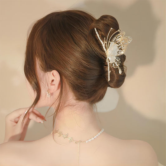 Charmante pince à cheveux pour chignon papillon