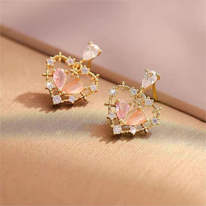 Boucles d'oreilles charmantes en forme de cœur creux et floral en cristal