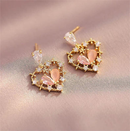 Boucles d'oreilles charmantes en forme de cœur creux et floral en cristal