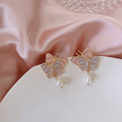 Boucles d'oreilles chics en émail avec nœud papillon et perles