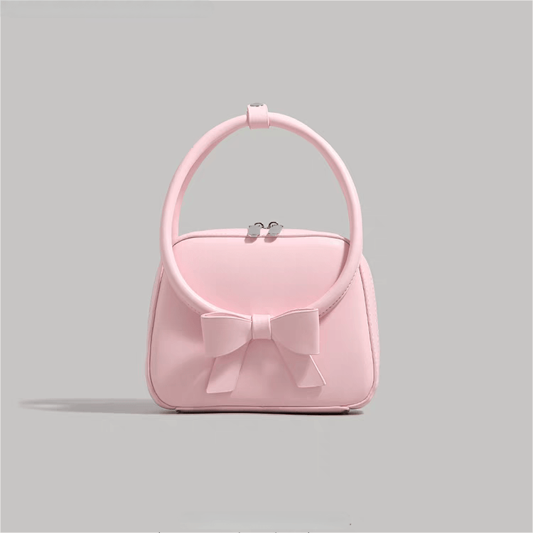 Sac à bandoulière en cuir avec nœud papillon rose