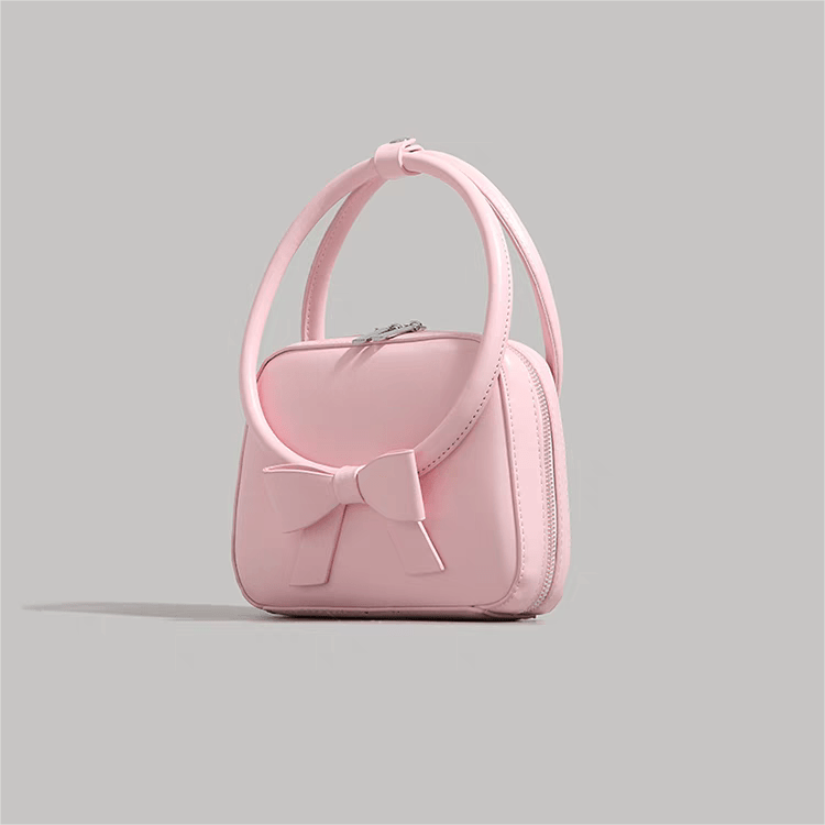 Sac à bandoulière en cuir avec nœud papillon rose