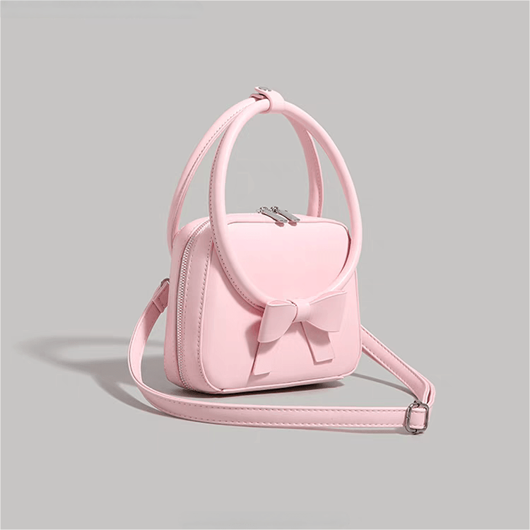 Sac à bandoulière en cuir avec nœud papillon rose