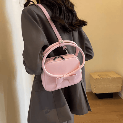 Sac à bandoulière en cuir avec nœud papillon rose