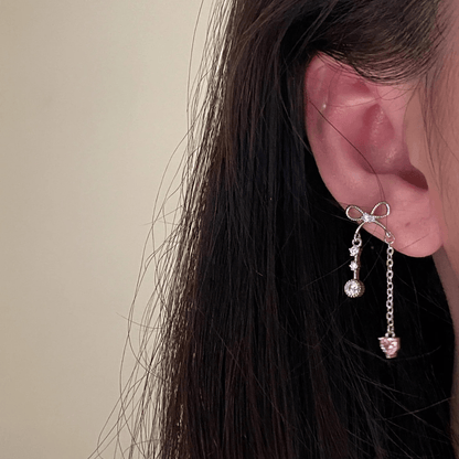 Boucles d'oreilles chics en forme de cœur avec nœud papillon et chaîne à pampilles