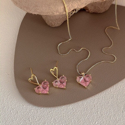 Ensemble collier et boucles d'oreilles pendantes en forme de cœur avec strass rose