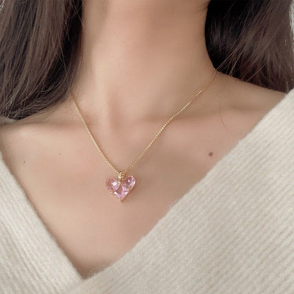 Ensemble collier et boucles d'oreilles pendantes en forme de cœur avec strass rose