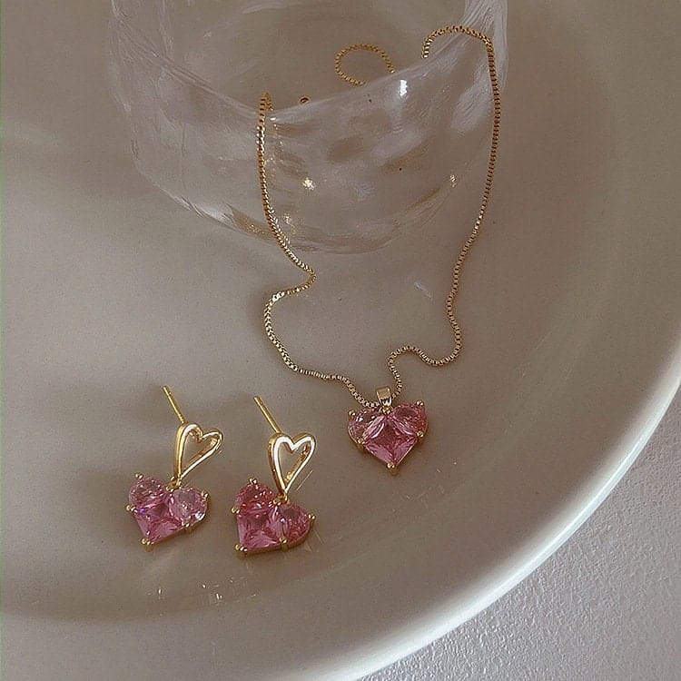 Ensemble collier et boucles d'oreilles pendantes en forme de cœur avec strass rose