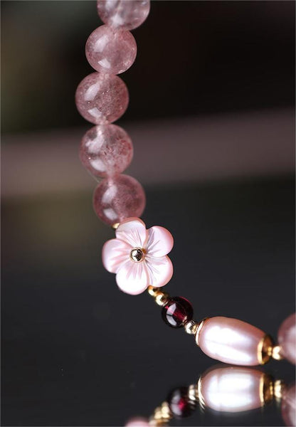 Bracelet en cristal rose doux avec fleur de cerisier