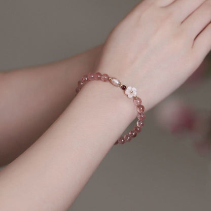 Bracelet en cristal rose doux avec fleur de cerisier